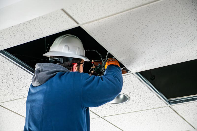 Electrician performing electrical panel upgrade