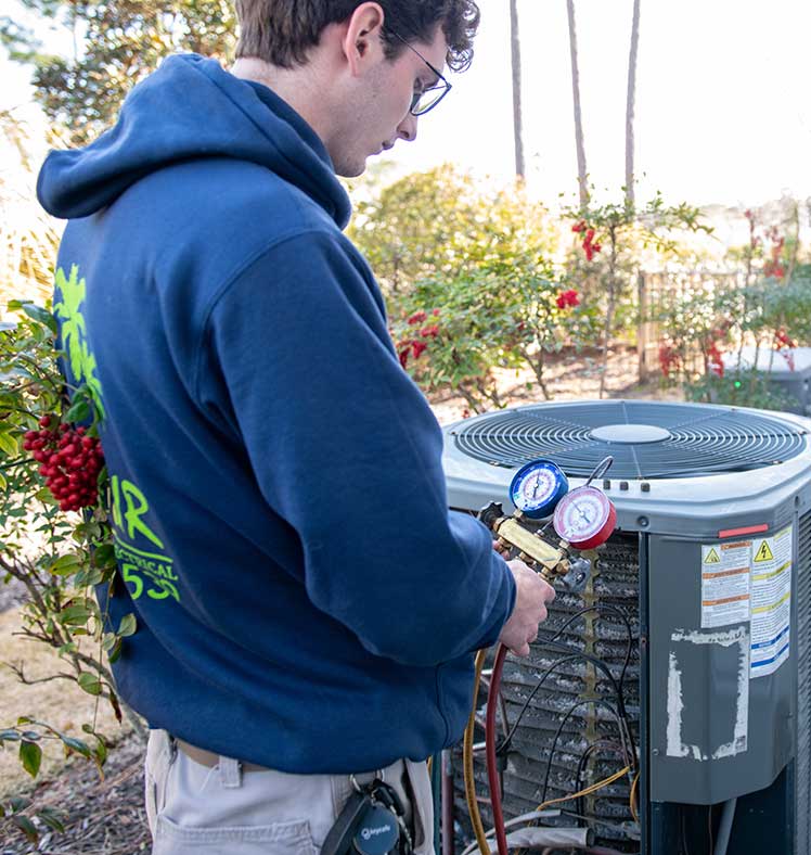 Technician performing heat pump intallation & replacement