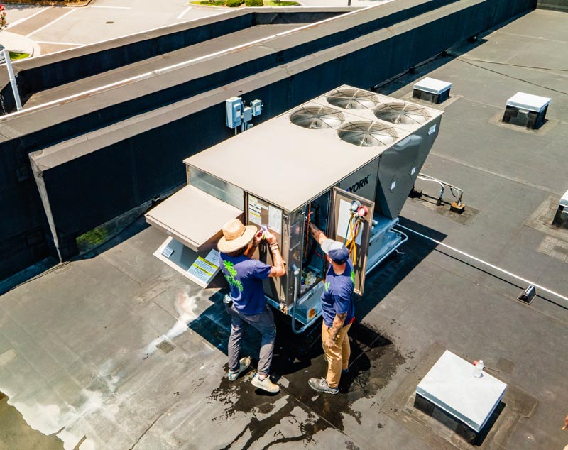 Technicians providing commercial HVAC services
