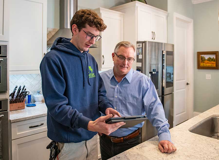 Technician explaining home care solutions